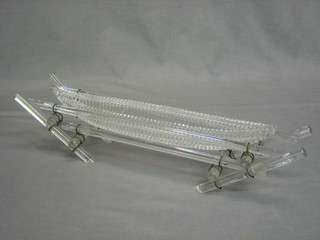 A Victorian glass boat shaped vase raised on glass crab stock supports 18"