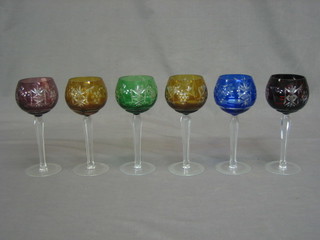 A set of 6 coloured long stem hock glasses (1 cracked)