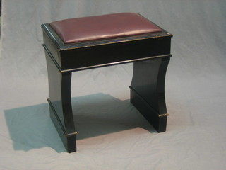 An ebonised box seat piano stool with hinged lid 19"