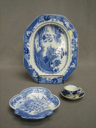 A 19th Century blue and white lozenge shaped meat plate 15" (chipped), a shaped blue and white bowl and a blue and white saucer