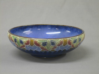 A circular Royal Doulton blue glazed bowl, the base impressed Royal Doulton X 8865 13773 and incised JH, 12"