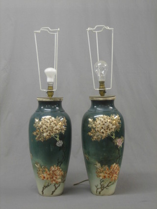 A pair of Oriental style green glazed pottery vases with floral decoration, converted to electric table lamps (drilled) 19"