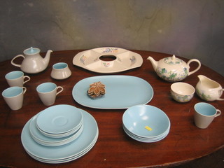 A Poole Pottery 4 division hors d'eouvres dish, a Poole blue meat plate 14" and a small collection of various Poole teaware, a Wade ashtray in the form of a cats mask and 2 leaf shaped ashtrays