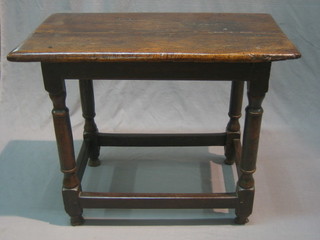 A 17th/18th Century rectangular oak table with plank top raised on turned supports 31"