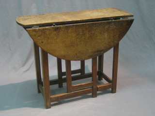 A 17th/18th Century bleached oak oval drop flap gateleg tea table, fitted a drawer 35"