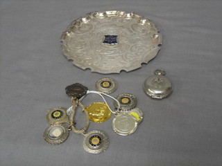 A circular silver plated salver for the Vintage Motor Cycle Club 6", 9 various watch chain medallions and a seal contained in a carrying case