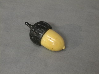 An ebony and ivory needle case in the form of an acorn 2"