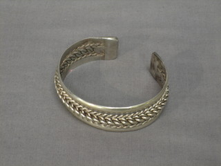 A pierced silver bracelet