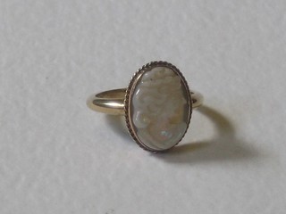 A 9ct gold dress ring set an oval cut cameo