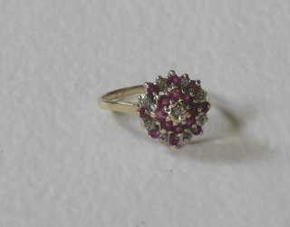 A lady's 9ct gold cluster dress ring set a pink sapphire and numerous diamonds