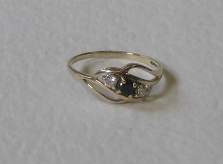 A lady's 9ct gold dress ring set a sapphire supported by 2 diamonds