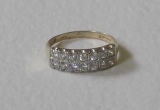 A lady's 9ct gold dress ring set numerous diamonds