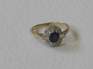 A lady's 18ct yellow gold dress ring set a circular cut sapphires and with 2 baguette cut diamonds to the shoulders and supported by numerous diamonds