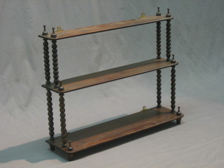 A Victorian style mahogany 3 tier hanging what-not raised on bobbin turned supports 28"