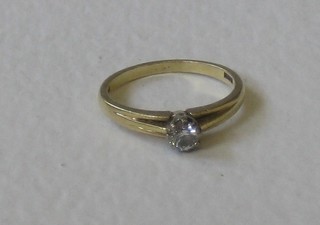 A lady's 18ct yellow gold dress/engagement ring, set a solitaire diamond