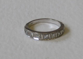 A lady's 18ct white gold half eternity ring set diamonds
