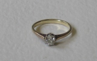 A lady's gold dress/engagement ring set a solitaire diamond, approx 0.65ct