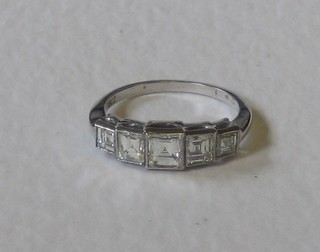 A lady's 18ct white gold dress ring set 5 Princess cut diamonds, approx 1.45ct