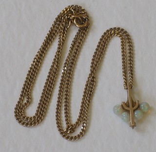 A 9ct gold pendant set opals, hung on a gold chain