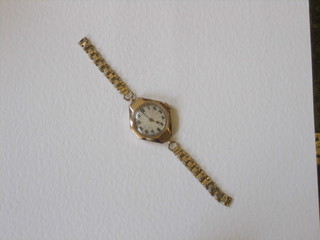 A lady's gold wristwatch, the movement marked Rolex patent, contained in a 9ct gold case (hinge f)