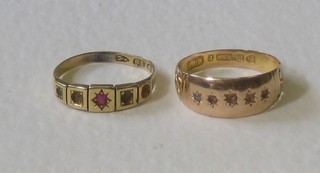 An 18ct gold dress ring set a red stone (others missing) and a 15ct gold dress ring (stones missing)