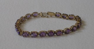 A gilt metal bracelet set amethysts