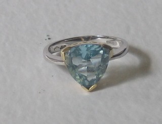 An 18ct white gold dress ring set a heart shaped aquamarine
