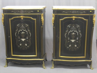 A pair of Victorian style lacquered  Pier cabinets with white veined marble tops and gilt metal mounts enclosed by panelled doors, inlaid heavily throughout with brass and gilt ormolu, raised on scroll supports 33"