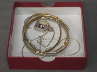 2 gilt metal bangles set white stones, a silver coloured ditto and a silver pendant set amethyst