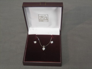 A 9ct white gold chain set a white stone heart shaped pendant