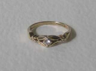 A 9ct gold dress ring set a round brilliant cut diamond, approx 0.10ct