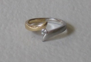 An 18ct yellow and white gold crossover dress ring, set diamond, approx 0.08ct