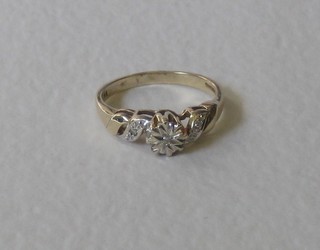 A yellow gold dress ring with 3 illusion set diamonds