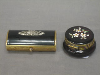A gilt metal and black enamelled lipstick case 3" (f), together with a circular glass jar the lid with enamelled floral decoration 2"
