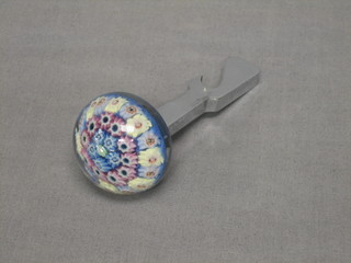 A chromium plated bottle opener, the top in the form of a Millefiori paperweight