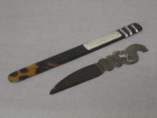 An Edwardian tortoiseshell and silver mounted paper knife decorated a serpent 8", together with a carved Indian tortoiseshell paper knife