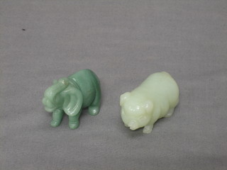 A carved green hardstone figure of an elephant 1" and a ditto pig 1"