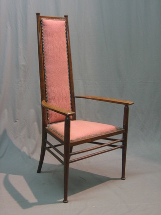 An Art Nouveau mahogany show frame open arm carver chair, raised on turned supports