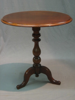 A Victorian oval tea table raised on pillar and tripod supports 26"