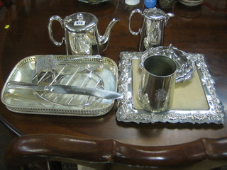 A silver plated hotelware teapot, ditto hotwater jug, a square silver plated bread board with insert, a rectangular galleried silver plated tea tray and a small collection of plated items