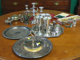 A silver plated 3 light candelabrum, 4 circular silver plated platters and a quantity of various silver plated flatware