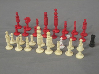 A carved white and red ivory chess set
