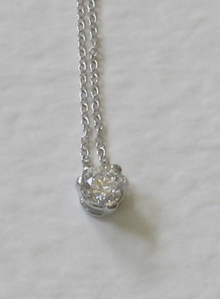 A diamond pendant hung on a fine chain, approx 0.40ct
