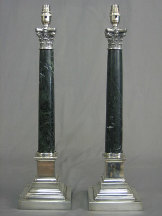 A pair of marble and silver plated table lamps in the form of marble columns with Corinthian capitals and stepped bases 20"