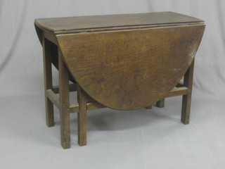 An 18th Century oak oval dropflap gateleg dining table raised on square supports with box framed stretcher 40"