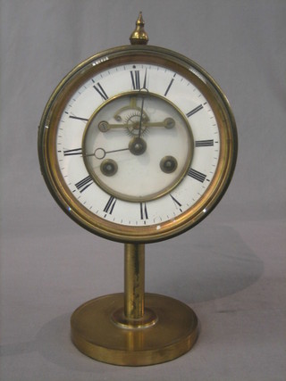 A Victorian French striking mantel clock with porcelain dial and Roman numerals with visible escapement contained in a gilt drum case 7"