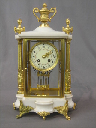A handsome French 19th Century 4 glass clock with enamelled dial and Arabic numerals, contained in a gilt alabaster 4 glass case, with twin mercury pendulum (slight chip to front left hand side and slight chip to glass on back door)