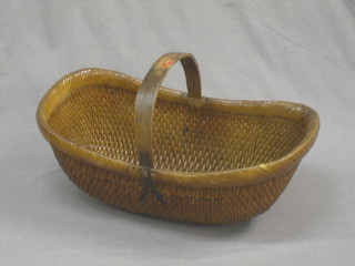 A reproduction Eastern boat shaped basket