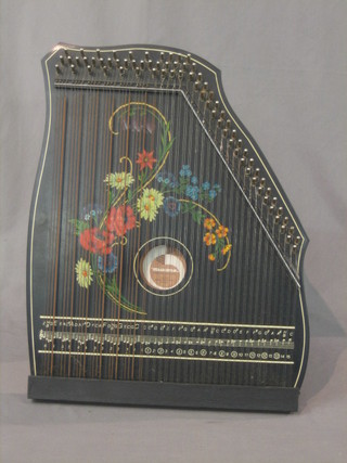 A German Democratic Republic  harp Zither, contained in a black case with poppy decoration 20"