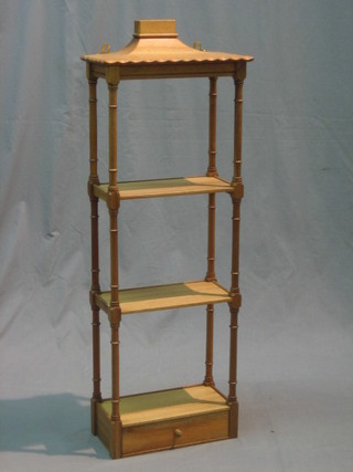 A Regency style bleached mahogany 3 tier what-not, raised on turned and block supports the base fitted a drawer 13"